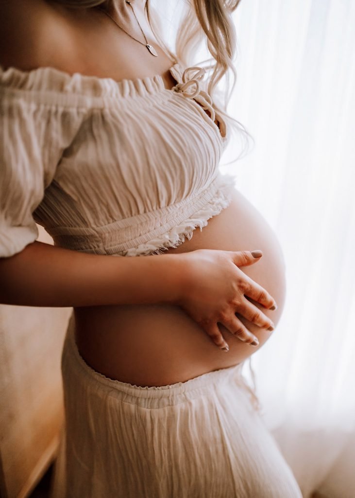 Outdoor maternity photoshoot at golden hour